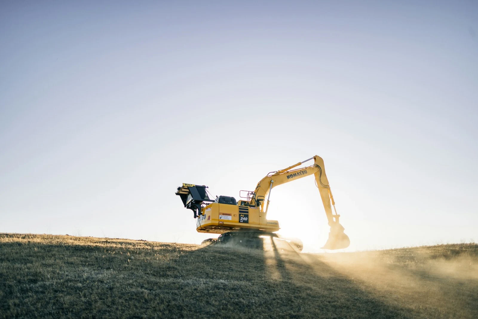Excavator on a hill — land clearing across Volusia County and Central Florida