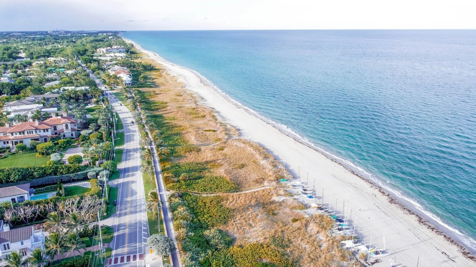 Ormond Beach coastal community with lush trees lining beachside roads