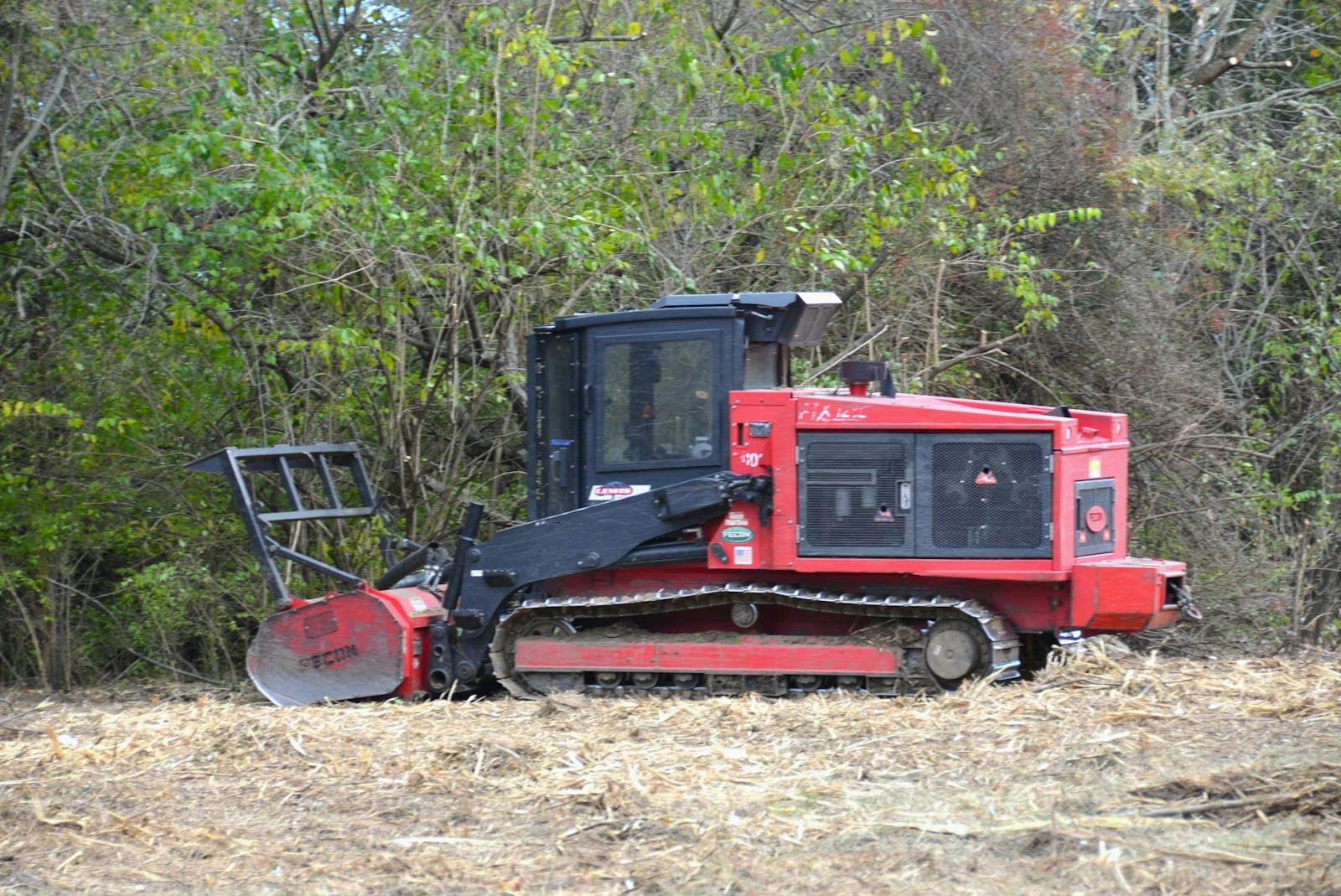 Red tractor in a field for wildfire fuel reduction
