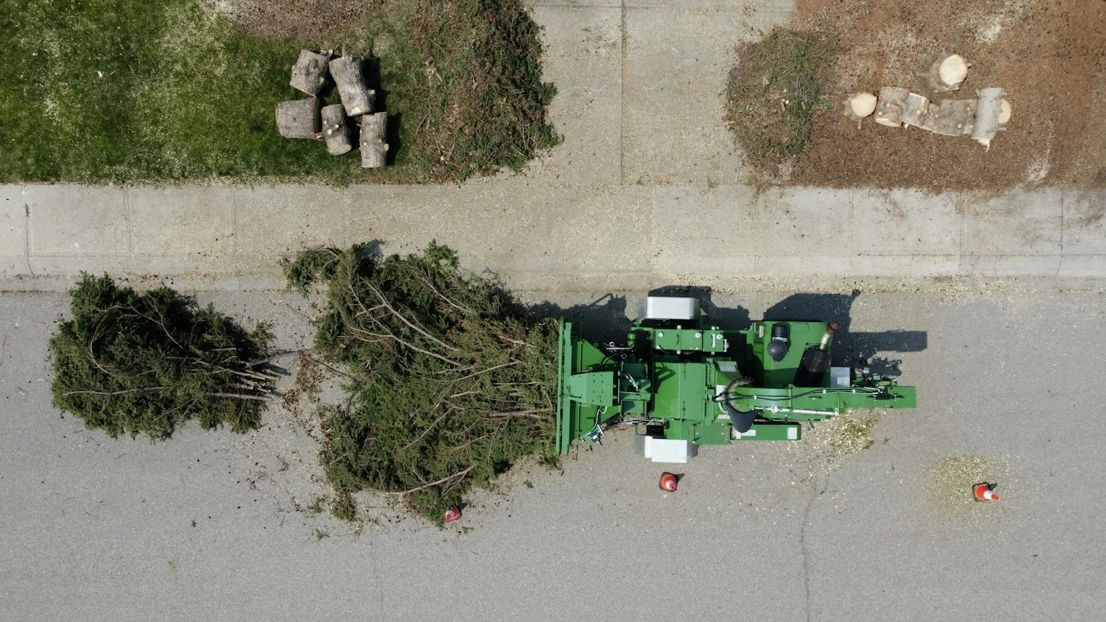 Tree chipper processing large tree debris