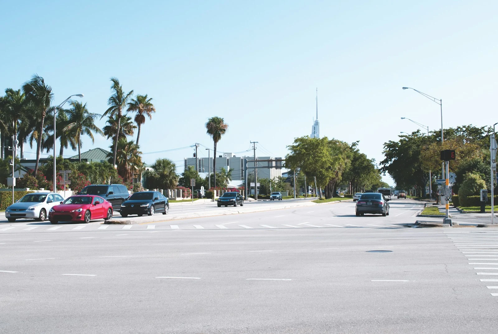 Vehicles on road near buildings in Orlando during daytime