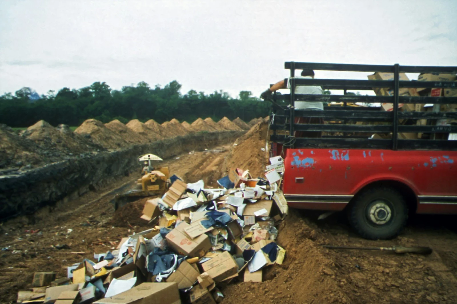 Grapple truck clearing debris from a residential property